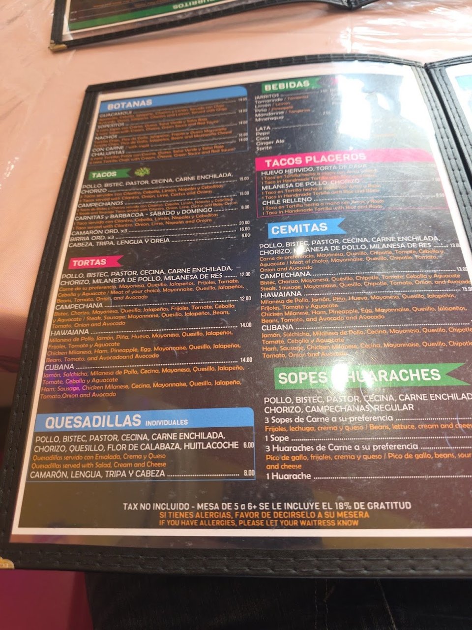 Printed menu with tacos and tortas.